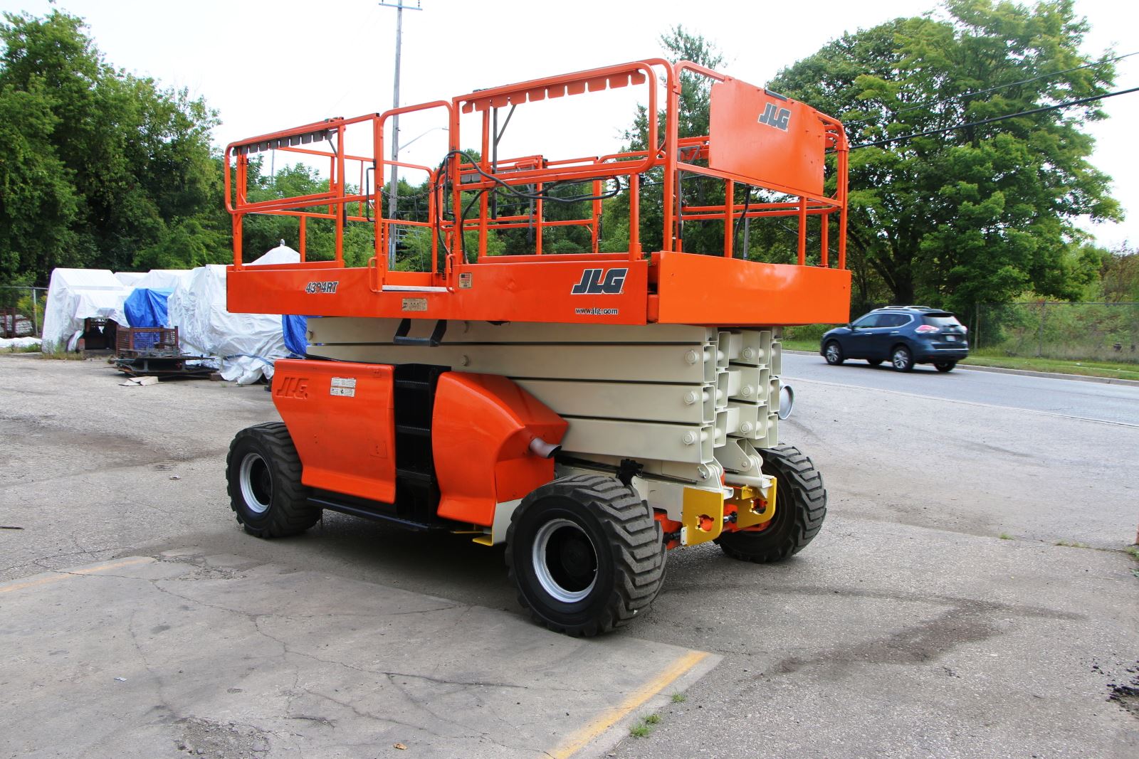 Used JLG 4394RT Rough Scissor Lift For Sale | Beta Die Casting